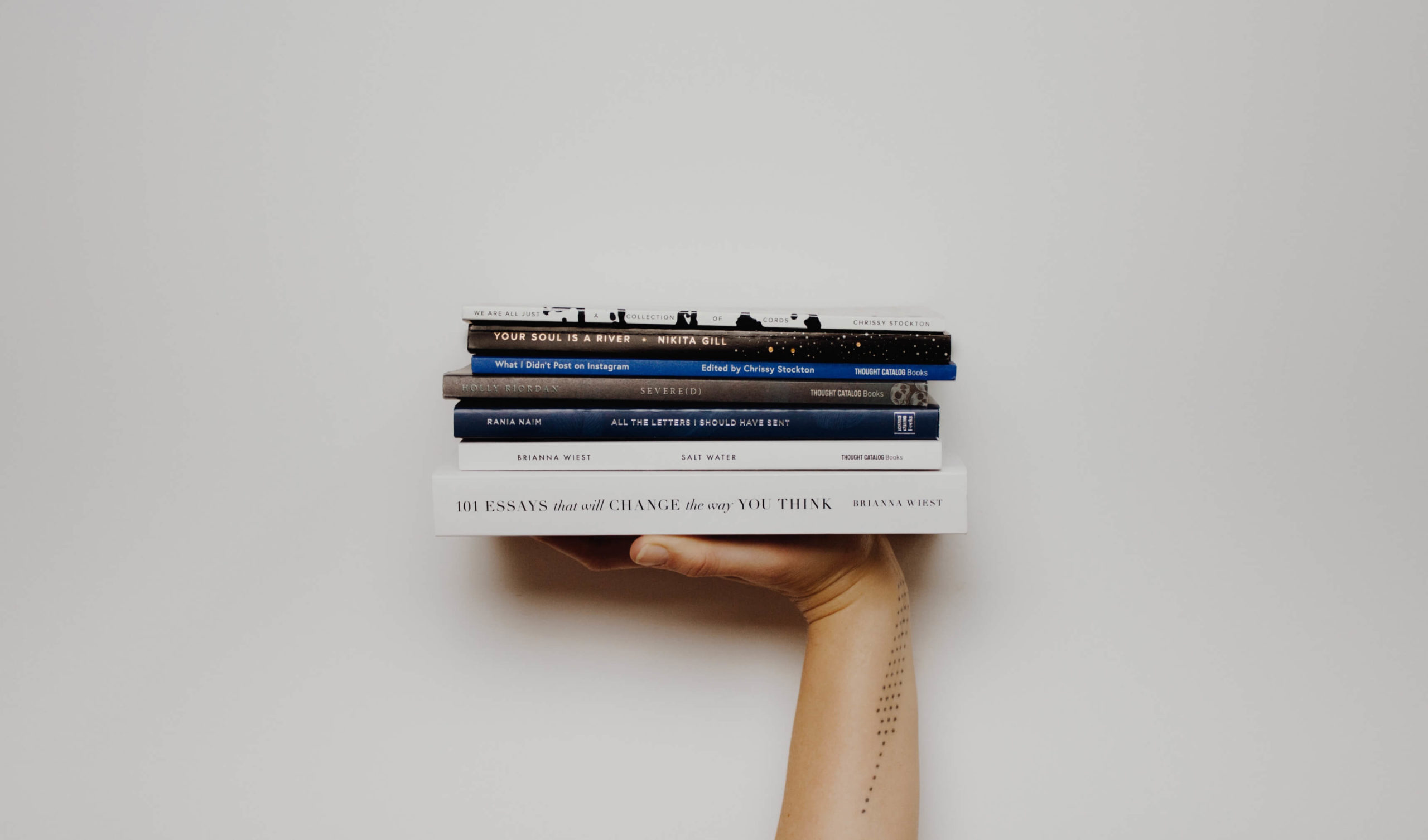 Hand holding books thumb-11@2x